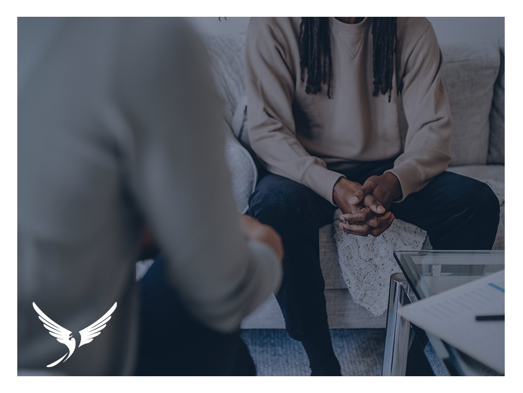 A man sitting down for a stressful conversation